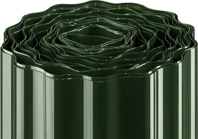 A roll of dark green garden edging with a wavy pattern, coiled tightly.