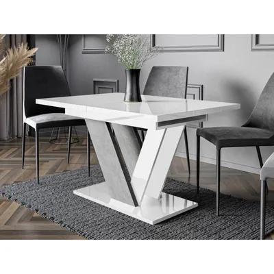 A dining table with chairs in a modern dining room setting.
