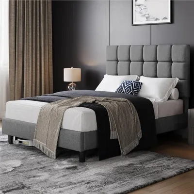 A bedroom scene with a bed, curtains, and a lamp.