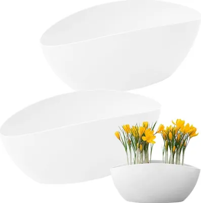 Two white oval-shaped planters are shown against a white background. One planter is empty, and the other contains yellow flowers.