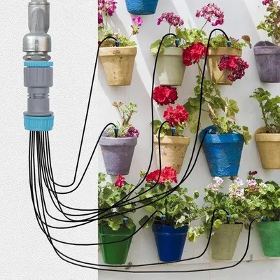 Zdjęcie produktu dla Zestaw automatycznych mikrodysz z 10 głowicami rozpylającymi i wężem ogrodowym o długości 52 stóp, przeznaczony do podlewania kwiatów, roślin doniczkowych, warzyw i upraw szklarniowych.