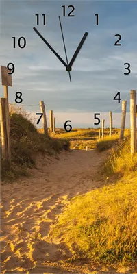 Produktbild von Wallario Design Wanduhr bedruckt, Größe 30 x 60 cm, Motiv: Düne am Strand bei Sonnenuntergang in Frankreich