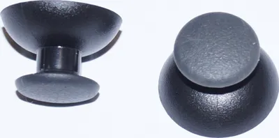Two black and gray joystick caps for a game controller are shown against a white background.