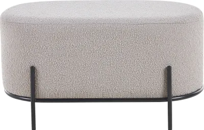 A taupe bouclé fabric ottoman with black metal legs is shown against a white background.