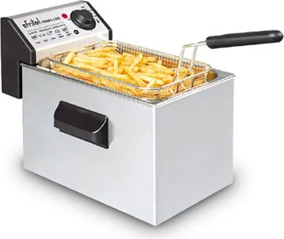A deep fryer filled with french fries, shown from a slightly elevated angle.