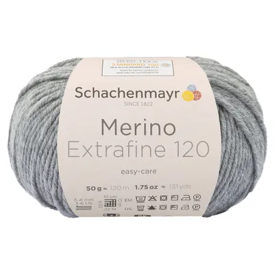 A ball of grey yarn with a label wrapped around it.
