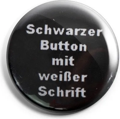 Produktbild von Schwarzer Ansteckbutton mit 25mm Durchmesser und weißer Schrift für Kleidung