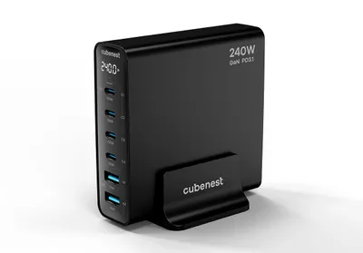 A black Cubenest 240W GaN PD3.1 charger with multiple USB-C and USB-A ports, displayed on a stand.