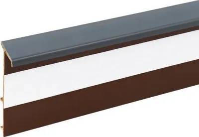 A close-up, angled view of a carpet trim strip.