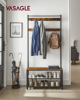 An entryway with a coat rack, shoe bench, and umbrella stand.
