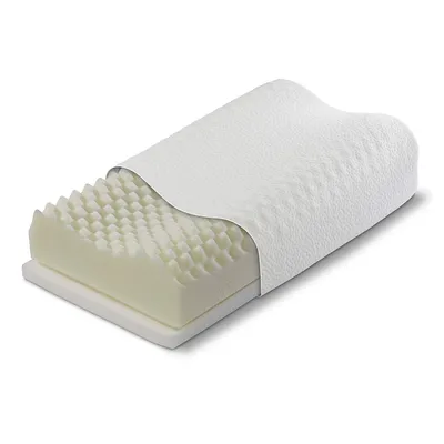 A cutaway view of a white orthopedic pillow with a textured cover, revealing its foam interior.