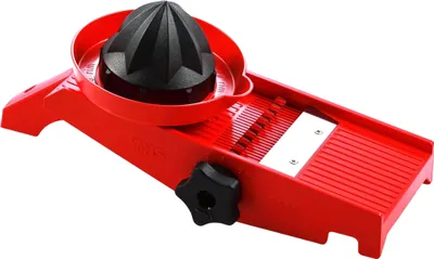 A red and black vegetable slicer with a lemon juicer attachment is shown against a white background.
