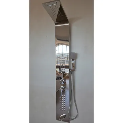 A modern chrome shower panel mounted on a light gray wall.