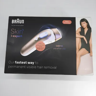 The image shows the packaging for a Braun Skin i-expert IPL hair removal system. A woman is featured on the right side of the box.