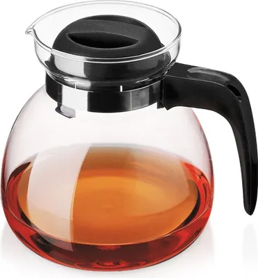 A glass teapot filled with amber liquid.