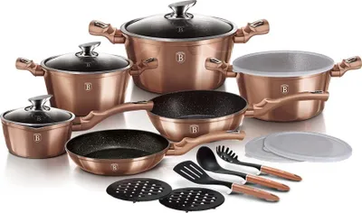 A set of rose gold cookware and kitchen utensils arranged on a white background.