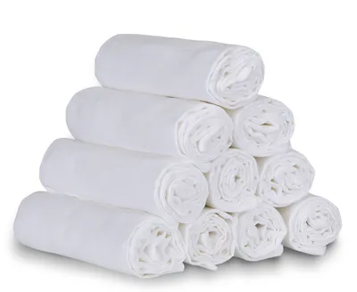 A stack of white rolled-up cloth diapers.