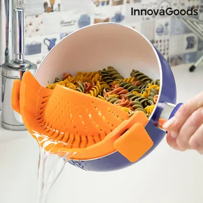 Produktbild von InnovaGoods® Sitko do odcedzania de Silikonowe sitko do pasty, wolne od BPA, sitko do odcedzania 22 x 6 x 8 cm, odpowiednie do garnków i patelni, można myć w zmywarce, silikonowe, pomarańczowe.