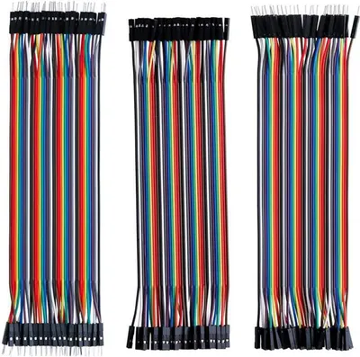 Three bundles of colorful jumper wires are laid out vertically against a white background.