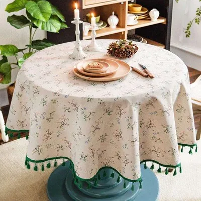 Imagen del producto de Mesa redonda Unyqoos® de algodón y lino, 150 cm – color beige con estampado floral y flecos, sin costuras, fácil de limpiar y de cuidado, ideal para el comedor y para picnics