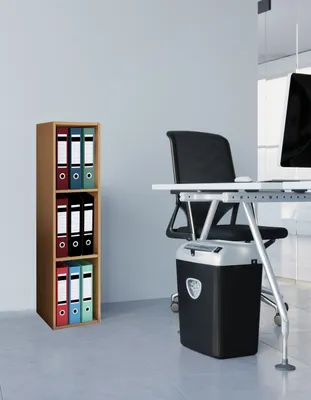 An office setting with a bookshelf and a desk.