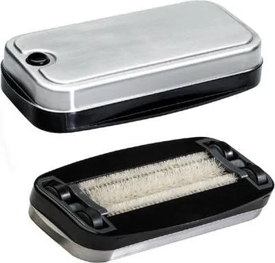 Two views of a handheld crumb sweeper.