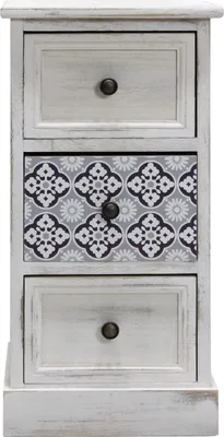 A narrow cabinet with three drawers, one of which has a decorative pattern.