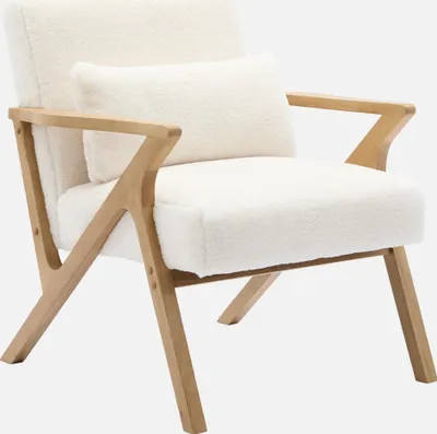 A white fluffy armchair with wooden legs and armrests, shown against a plain white background.