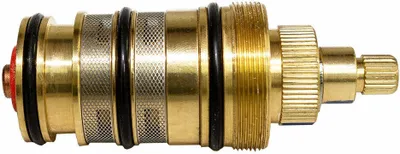 A close-up studio shot of a brass faucet cartridge.