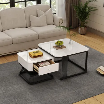A living room scene with a sofa and two nested coffee tables.