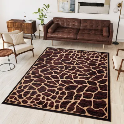 A living room scene with a brown leather sofa, a patterned rug, and a wooden cabinet.