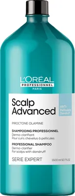 A studio shot of a large bottle of L'Oréal Professionnel shampoo.