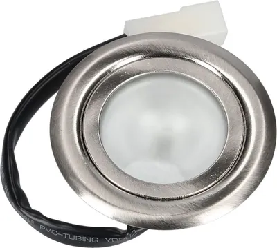 Close-up shot of a small, round, silver LED light fixture with a white frosted lens.