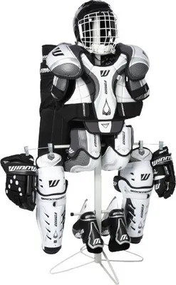 A full set of hockey equipment displayed on a drying rack.
