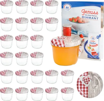 A set of glass jars with checkered lids and a recipe booklet, along with a single filled jar and a decorative plate.