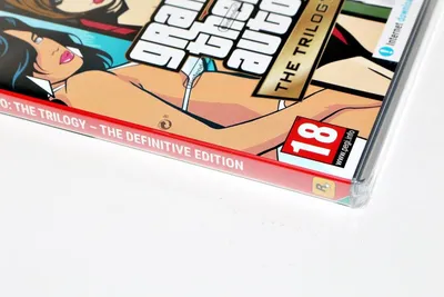 A close-up of the cover art for the Grand Theft Auto: The Trilogy – The Definitive Edition video game, showing stylized characters and the game's title.