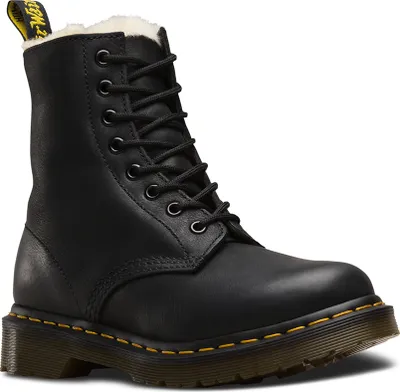 A black Dr. Martens boot with white fur lining.