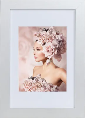 A framed picture of a woman adorned with roses.