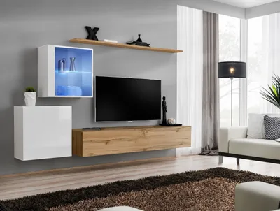 A modern living room with a wall-mounted entertainment unit.