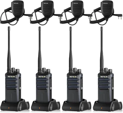 Four walkie-talkies with their charging bases and microphones are arranged in a grid on a white background.