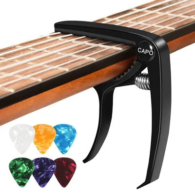 Immagine prodotto di Capotasto per chitarra, set con 6 plettri, metallo, nero