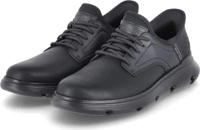 A pair of black Skechers shoes on a white background.