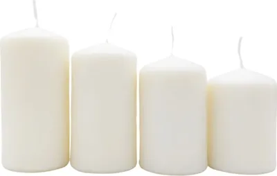 Four white pillar candles of varying heights are arranged in a line against a white background.
