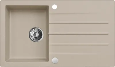 A top-down view of a beige composite kitchen sink with a drainer.