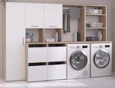 A laundry room with a modular cabinet system, two washing machines, and various laundry supplies.