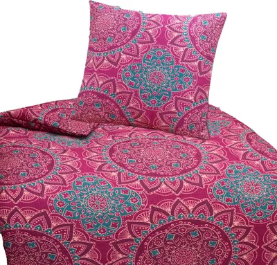 A close-up view of a pink bedding set with a mandala pattern.