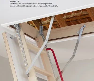Close-up view of a wooden attic ladder mechanism with metal springs and a red handle, installed in a ceiling opening.