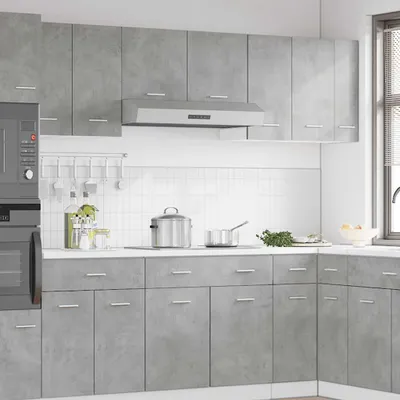 A modern kitchen with gray cabinets and appliances.