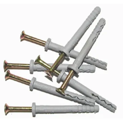 A pile of screws and wall anchors on a white background.