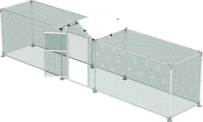 A long, rectangular outdoor enclosure for small animals, likely chickens, with a pitched roof over a central section and an open door.
